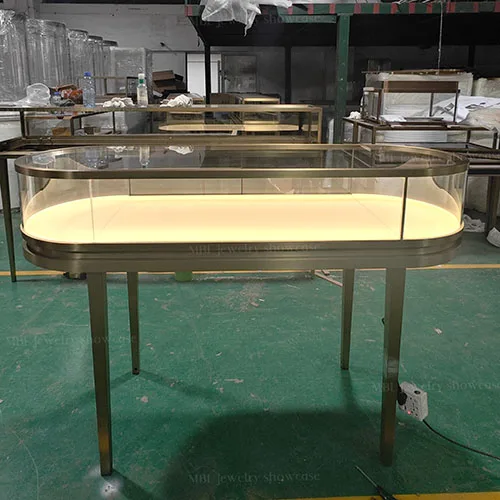 椭圆形珠宝销售柜定制 拉丝香槟金玻璃展示柜 轻奢首饰店专用柜台