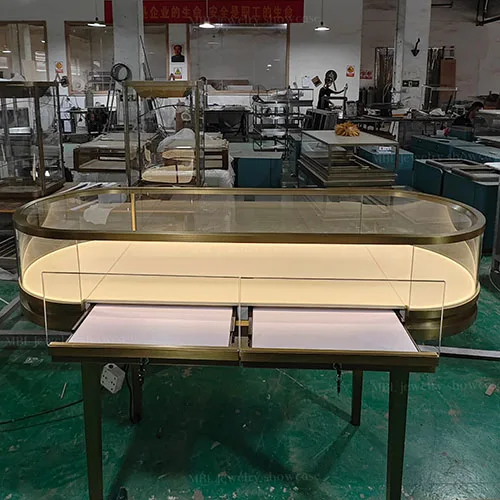 椭圆形珠宝销售柜定制 拉丝香槟金玻璃展示柜 轻奢首饰店专用柜台