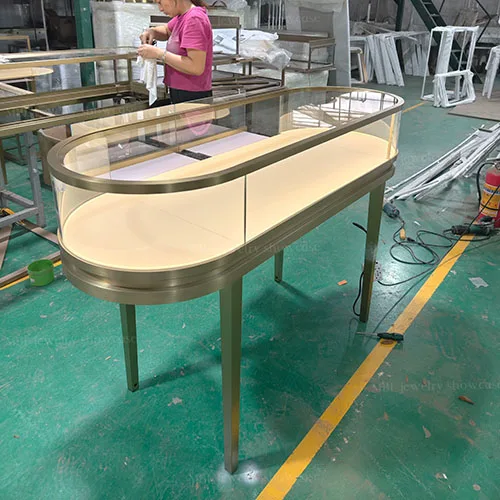 椭圆形珠宝销售柜定制 拉丝香槟金玻璃展示柜 轻奢首饰店专用柜台